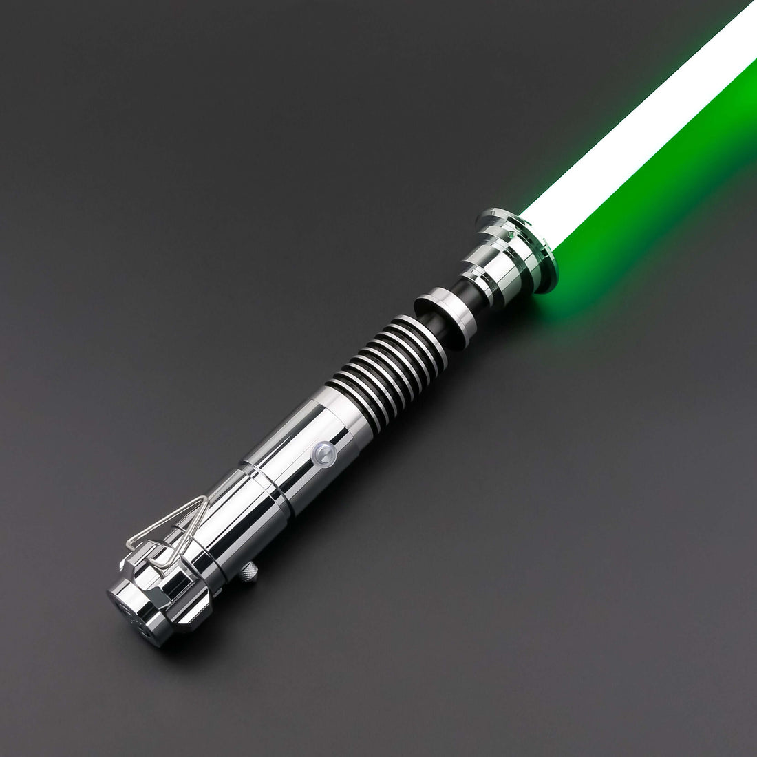Luke SE Lightsaber from Novasaber, featuring a polished silver hilt with detailed gold accents and a vibrant green blade, inspired by the iconic weapon of Luke Skywalker from Star Wars