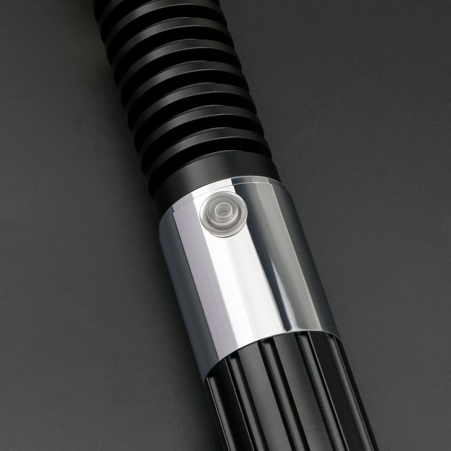 Close-up of the Obi-Wan Kenobi Neopixel Lightsaber hilt, showcasing its detailed design and button.
