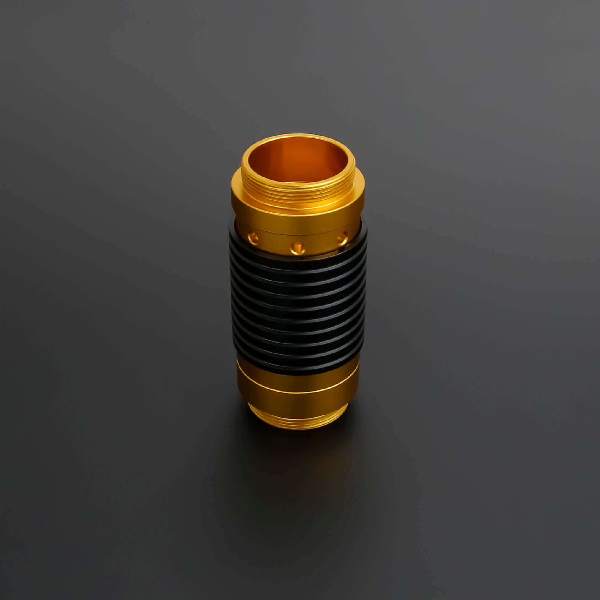 Universal quick release coupler in gold and black design for 1" diameter lightsaber handles.