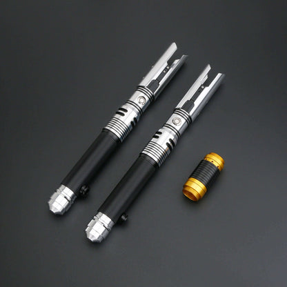 NovaSaber universal quick release coupler and two lightsaber handles on a black background.