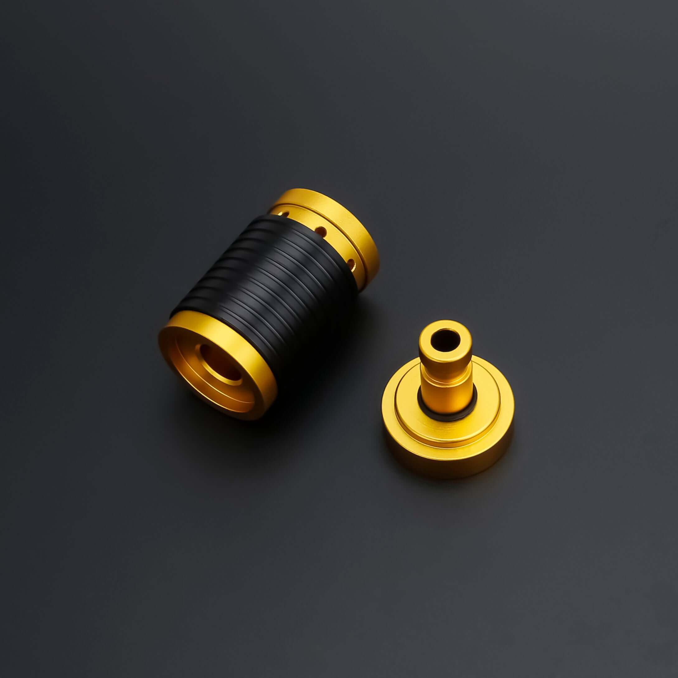 Universal quick release coupler shown in black and gold colors, designed for 1"-diameter lightsaber handles.