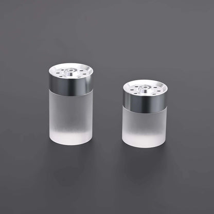 Ahsoka Tano CW lightsaber replica displayed alongside salt and pepper shakers with a sleek design.