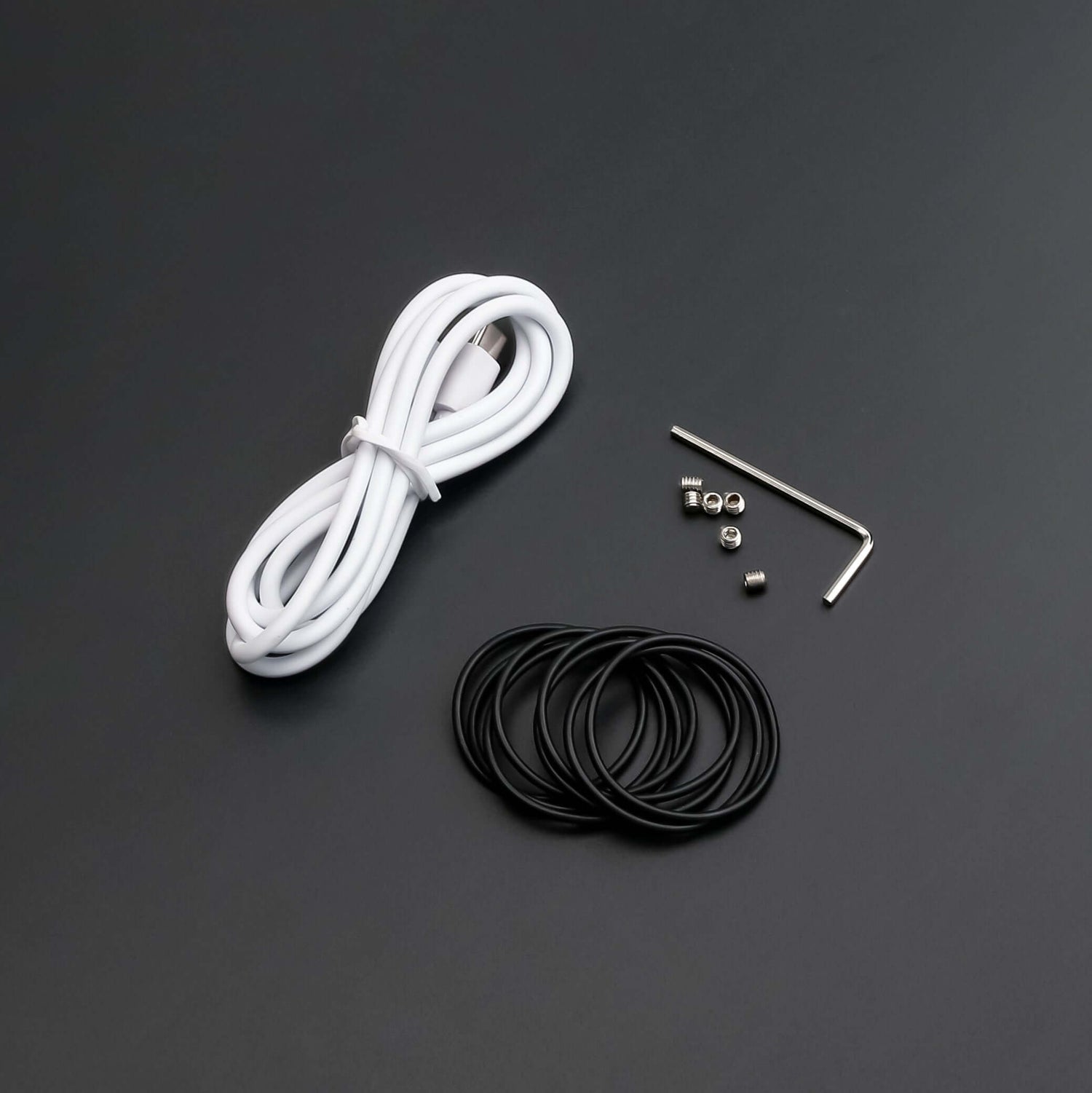 Essential tools for lightsaber maintenance kit including wires, screws, and rubber o-rings.