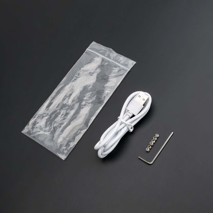 USB charging cable, maintenance tools, and components from the lightsaber maintenance kit.