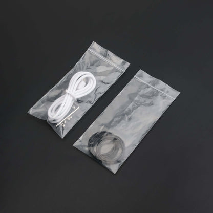 Clear bags containing cords and rings for lightsaber maintenance kit essentials.