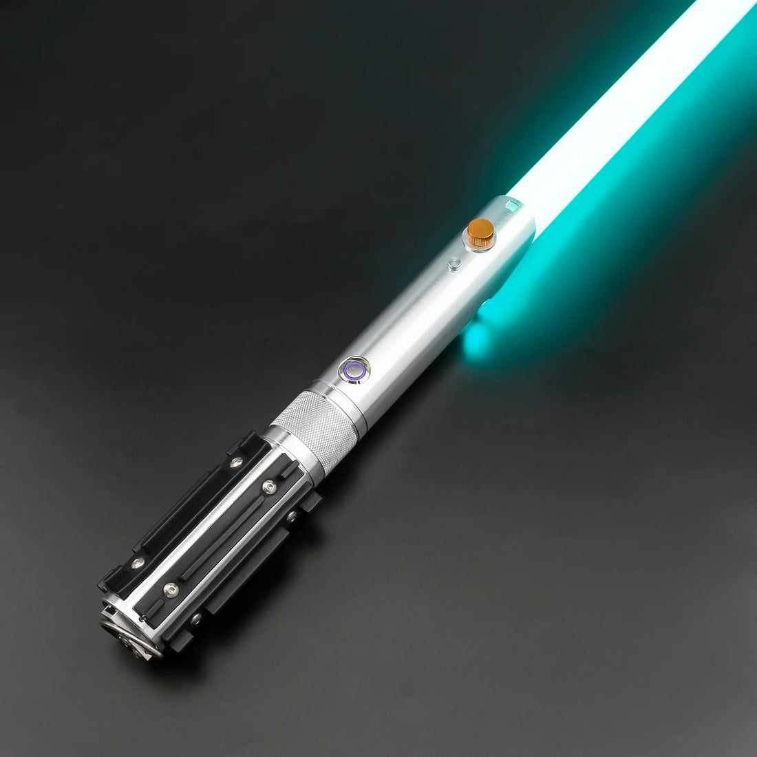 Combat Saber-Anakin with polished metal hilt and glowing turquoise blade on black background.