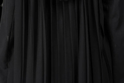 Close-up of the pleated fabric texture of the premium tactical enforcer suit in black.