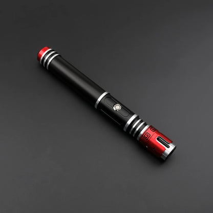 Crimson Vortex lightsaber featuring a polished hilt with red and silver accents on a black background.