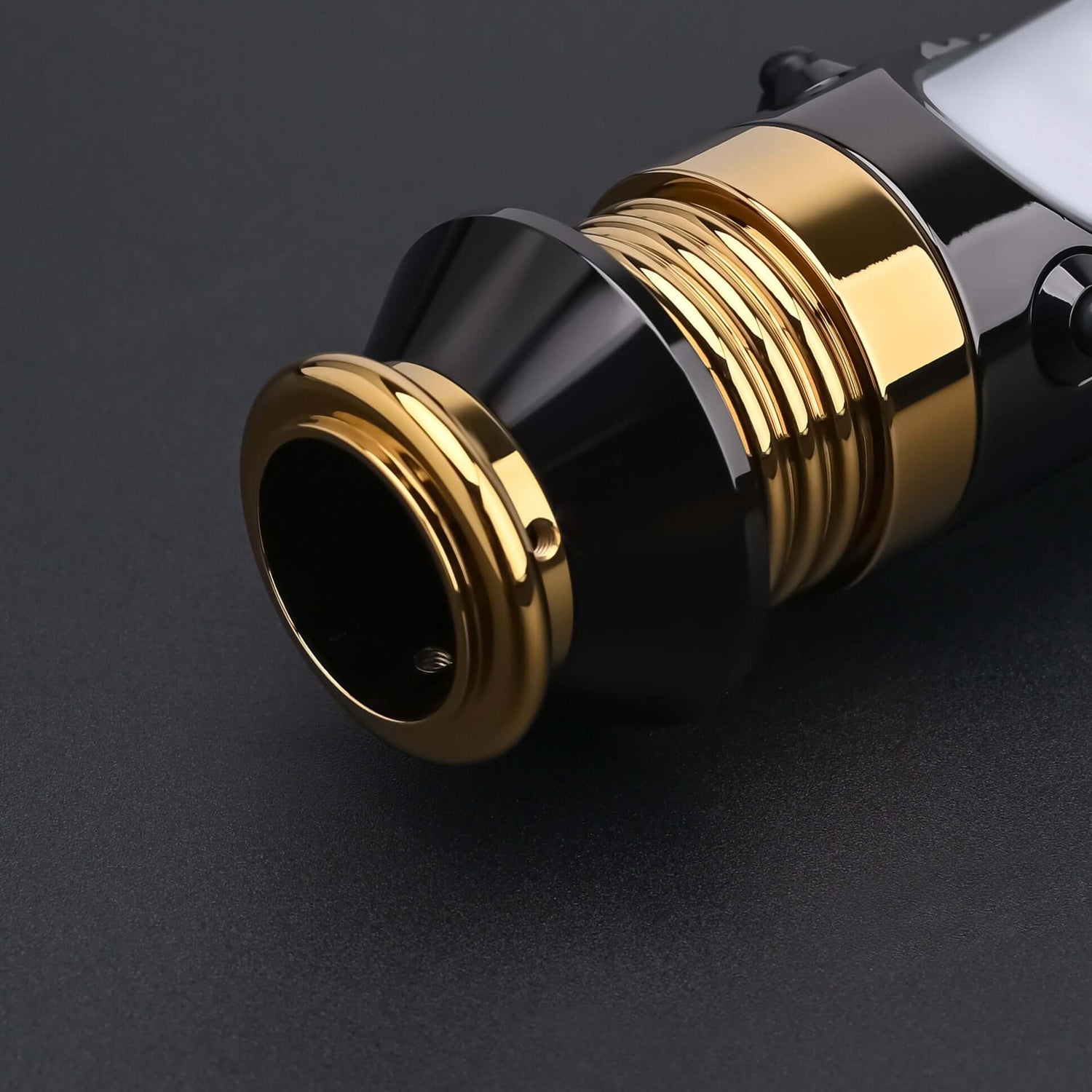 Close-up of the Emperor lightsaber emitter and gold-plated details