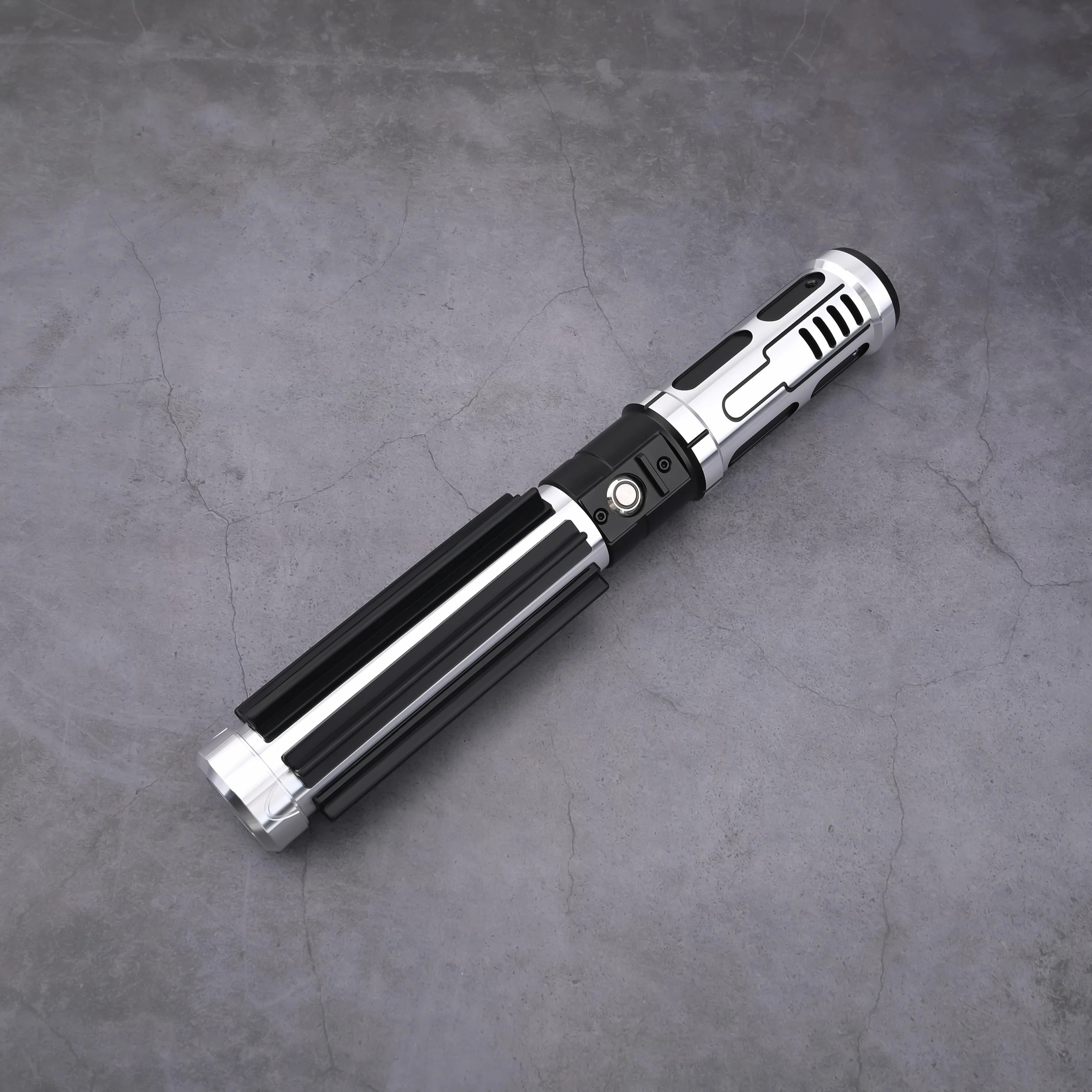 The Void Walker heavy dueling lightsaber with polished silver alloy and matte black finish on a concrete background.