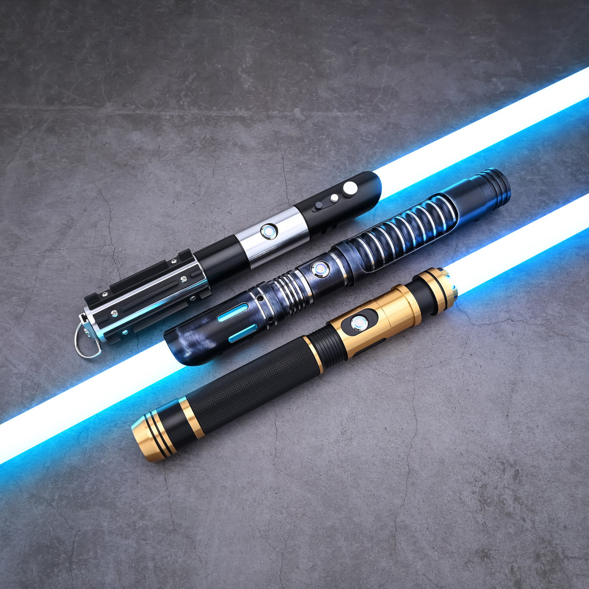 The Jedi Trinity lightsaber collection displayed with active blue blade illumination
