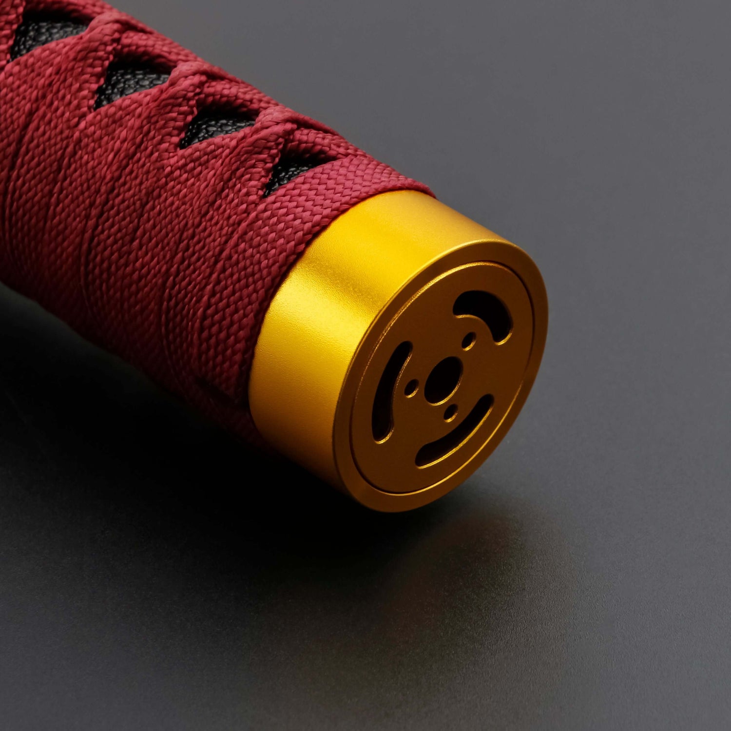 Sekiro Lightsaber: Katana-inspired design with gold hilt, red grip, and gold guard, crafted from aircraft-grade aluminum for durability and elegance.