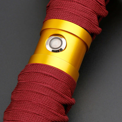 Sekiro Lightsaber: Katana-inspired design with gold hilt, red grip, and gold guard, crafted from aircraft-grade aluminum for durability and elegance.