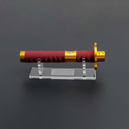 Sekiro Lightsaber: Katana-inspired design with gold hilt, red grip, and gold guard, crafted from aircraft-grade aluminum for durability and elegance.