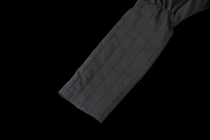 Premium tactical enforcer suit sleeve detail showcasing premium fabric and structural design.