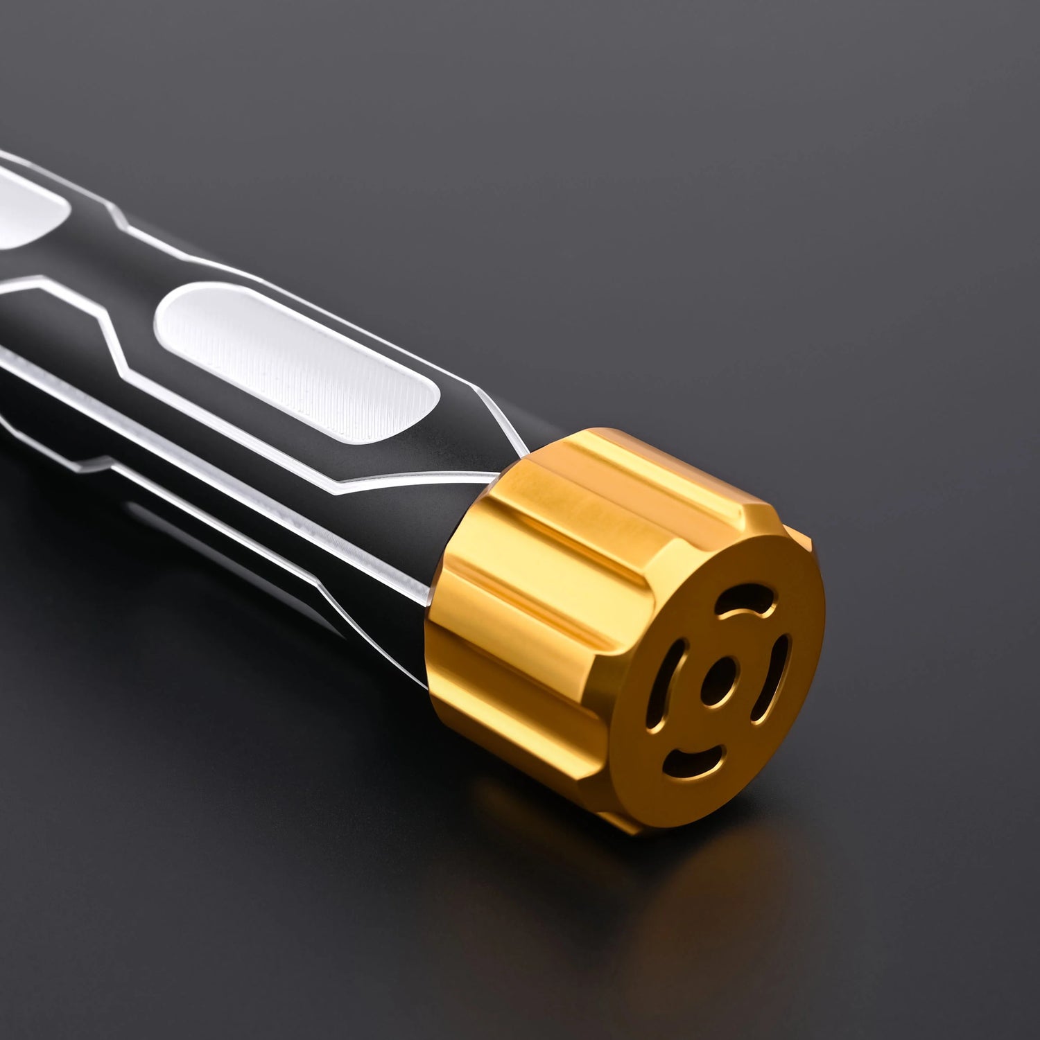 Close-up view of the Skyrim lightsaber pommel featuring premium gold-plated metal craftsmanship.