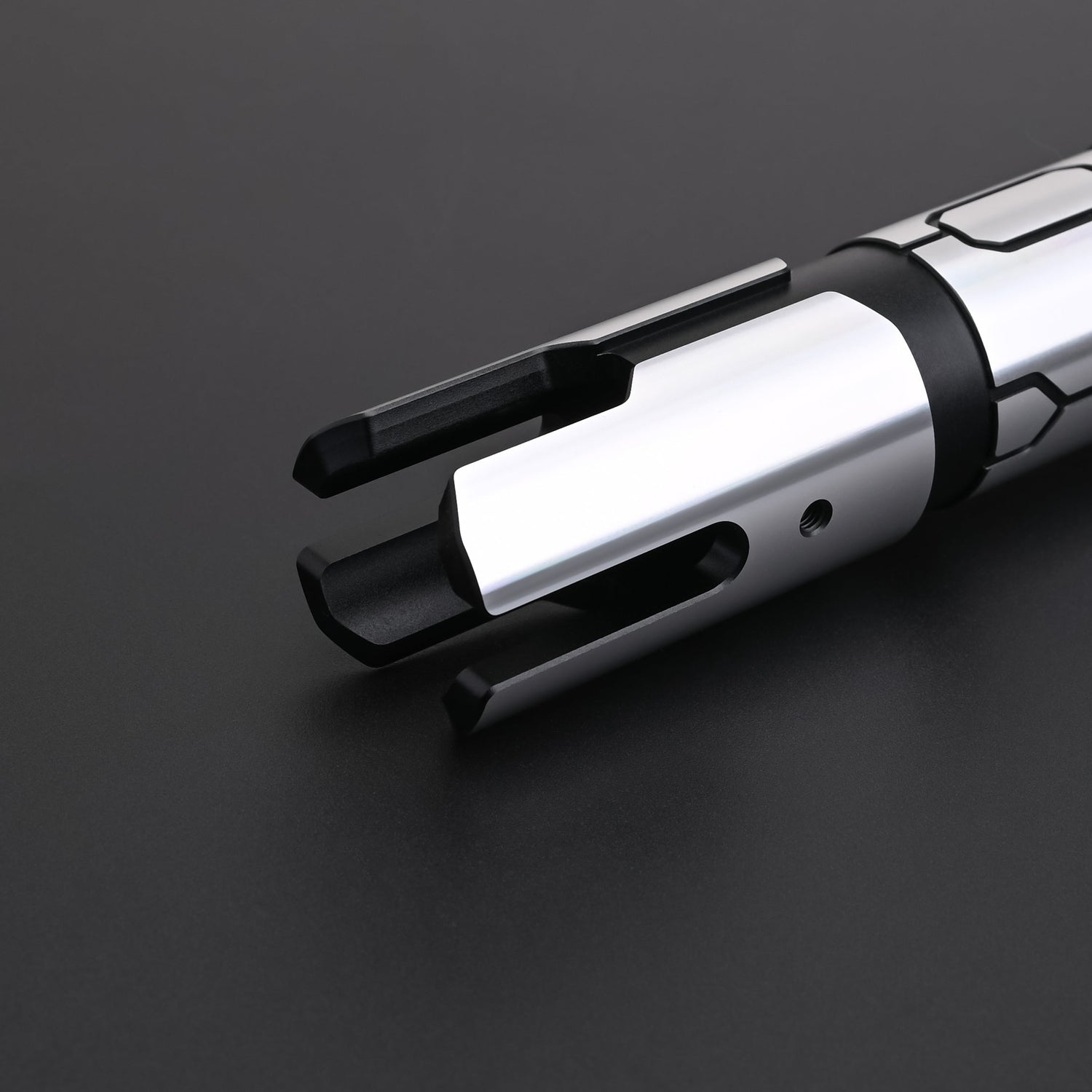 Close-up of the Obsidian Elite Trinity lightsaber emitter and hilt design details
