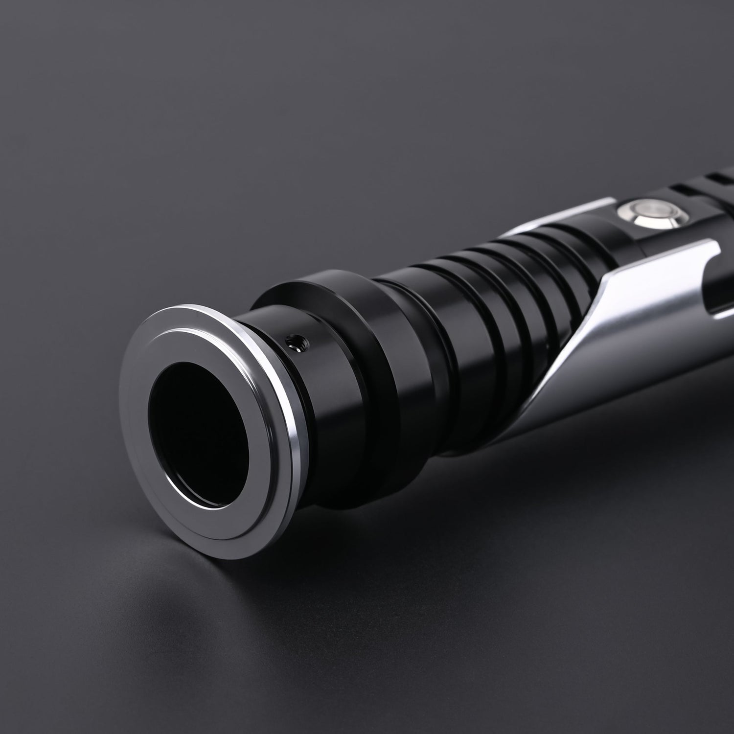 Detailed view of the Qui-Gon SE lightsaber emitter and top hilt construction