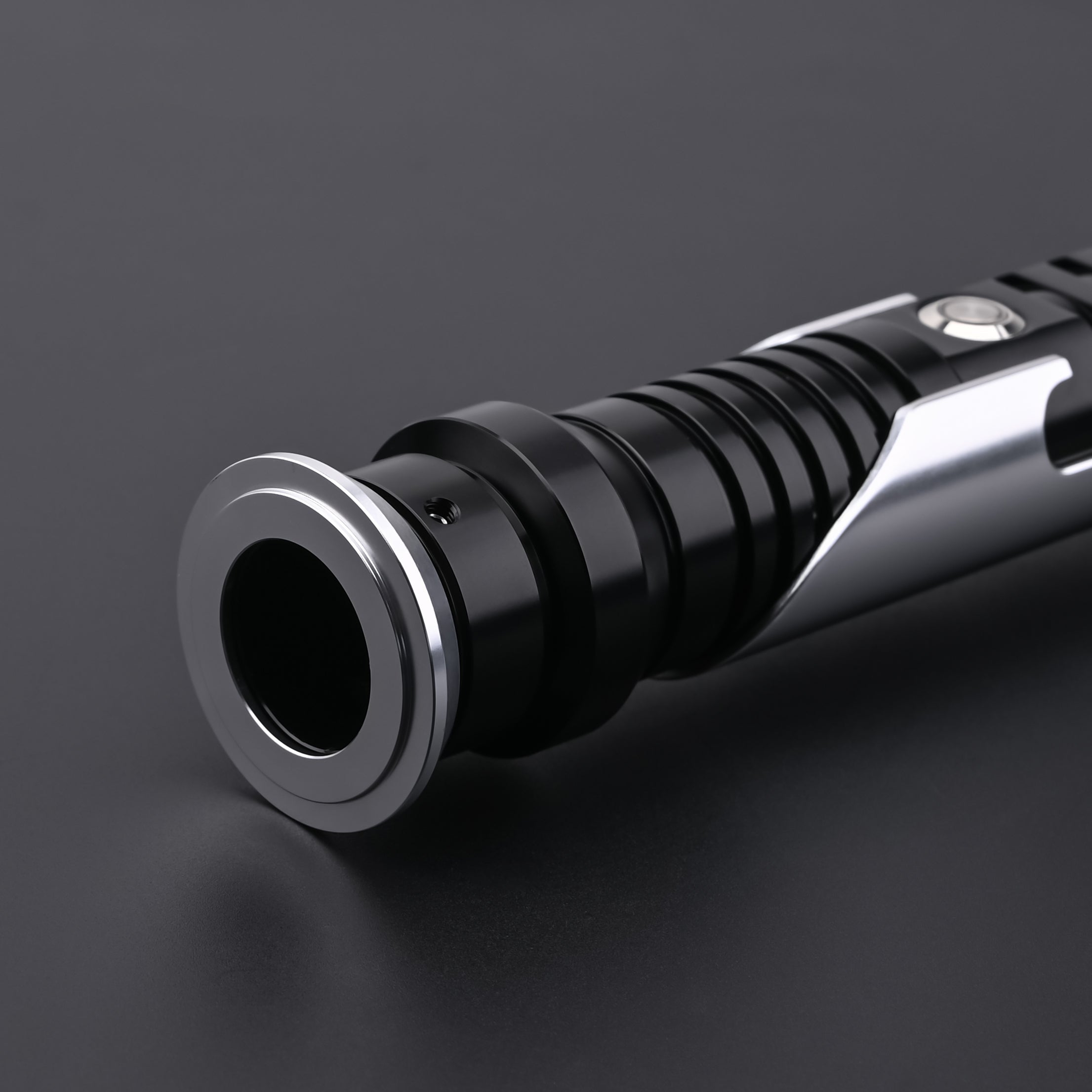 Detailed view of the Qui-Gon SE lightsaber emitter and top hilt construction