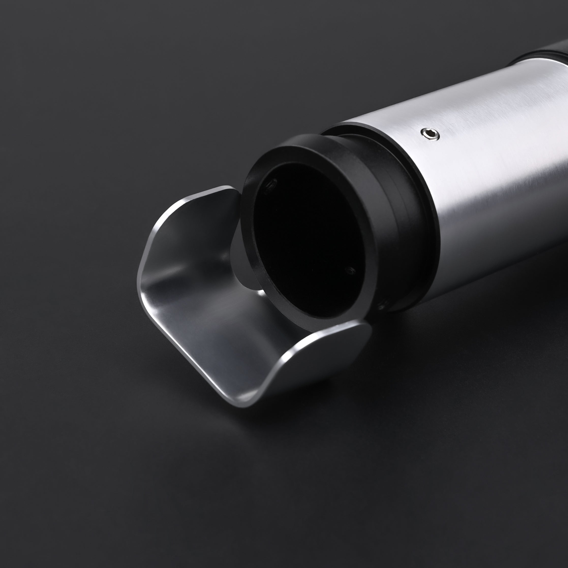 Close-up of the hilt of the Yoda SE Lightsaber, showcasing its sleek design and precision craftsmanship.