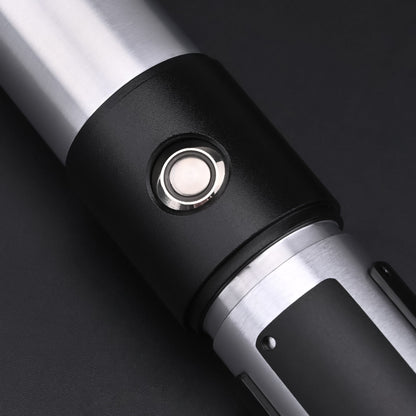 Close-up of the hilt and button of the Yoda SE Lightsaber, showcasing its design and craftsmanship.