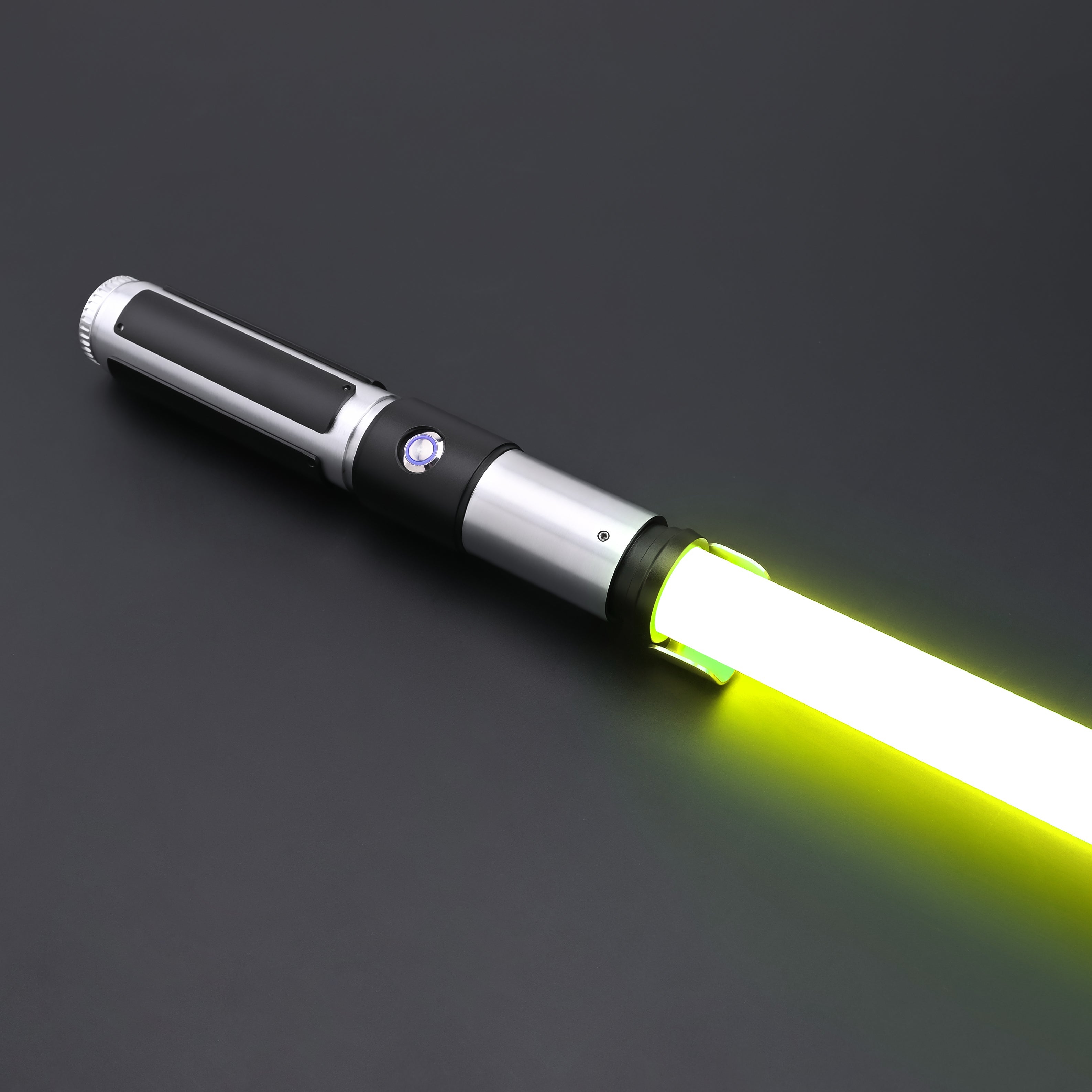 Yoda SE Lightsaber with a sleek hilt and glowing yellow blade against a dark background.